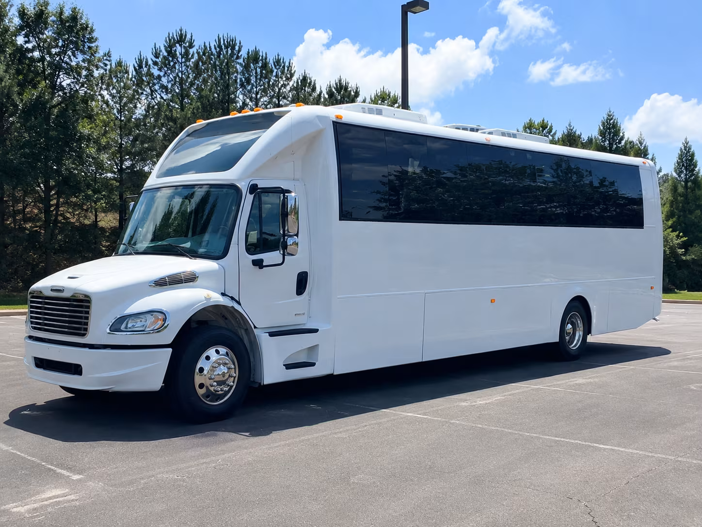 Group beside a Mercedes Sprinter limo in Akron